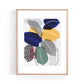 Calathea Pinstripe Plant Art Print by The Print Lass. Shown in a light wood frame on a white background